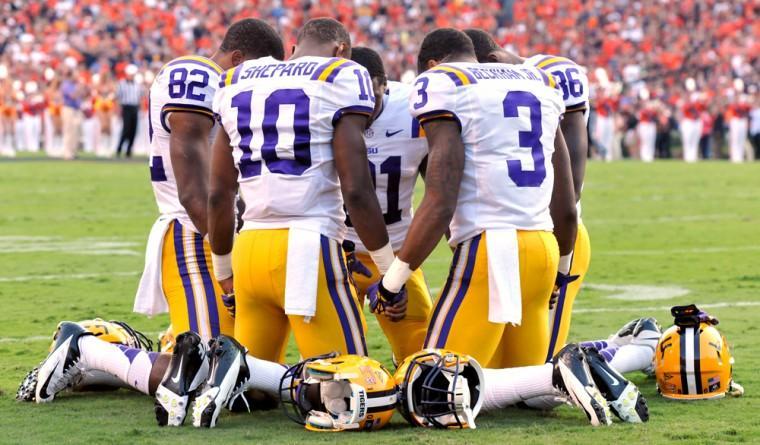 LSU wide receivers James Wright (82), Russell Shepard (10), Odell Beckham Jr. (3), Kadron Boone (86), and Armand Williams (81) huddle together before the Tigers' 12-10 victory over Auburn on Saturday Sept. 22, 2012 in Jordan-Hare Stadium.
 