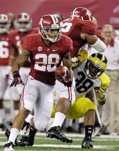 Alabama defensive back Dee Milliner runs back a turnover Saturday against Michigan in Cowboys Stadium.