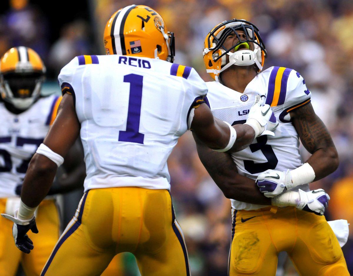 LSU sophomore wide reciever Odell Beckham Jr. (3) celebrates with LSU junior safety Eric Reid (1) after a touchdown strike by Beckham Jr. in Saturday's game vs North Texas in Tiger Stadium. Saturday, Sept. 1, 2012.