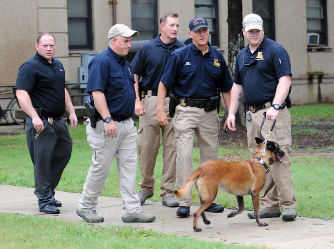 Officers search Evangeline Hall on LSU's campus Monday, Sept. 17, 2012 after a bomb scare.
 