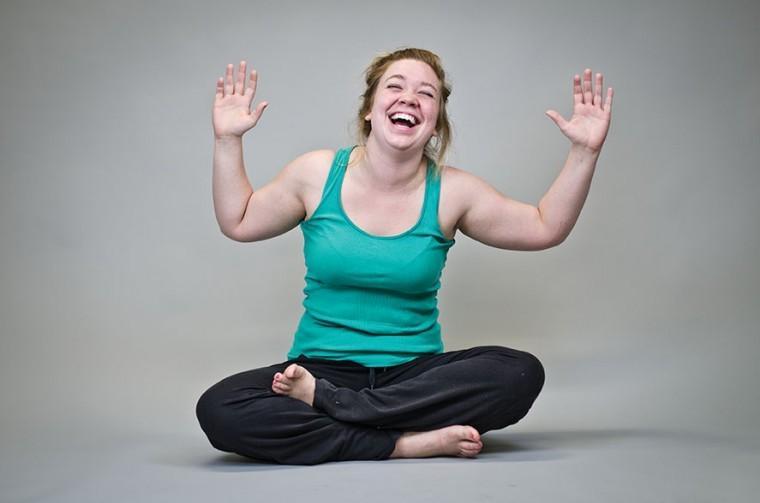 Hanna Browning giggles as she shows off a pose inspired by laughter yoga.
 