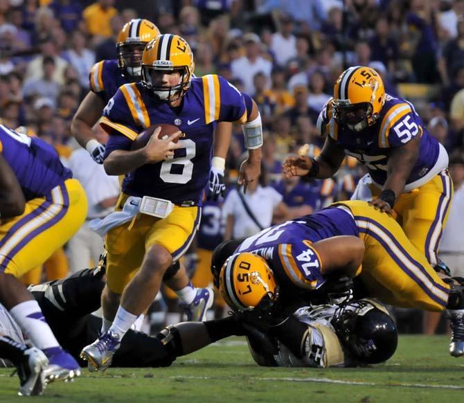 Junior quarterback Zach Mettenberger (8) runs the ball downfield Saturday, September 15, 2012 during the Tigers' 63-14 win over Idaho in Tiger Stadium.
 