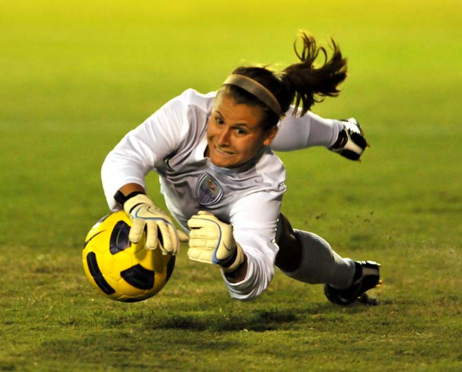 Junior goalkeeper Megan Kinneman dives to block a penalty kick Monday, Sept. 10, 2012 during the Tigers game against Memphis.
 