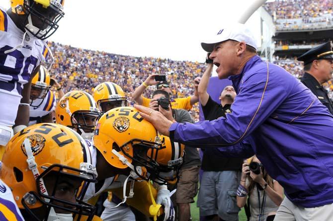 LSU head coach Les Miles holds back the Tigers before running through the tunnel on Saturday Sept. 8, 2012 during the Tigers' 41-3 victory over the Washington Huskies in Tiger Stadium.
 