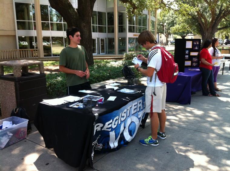 Volunteers set up a HeadCount table in Free Speech Plaza to gather support from the student population. HeadCourt registers voters and promotes political awareness.
 