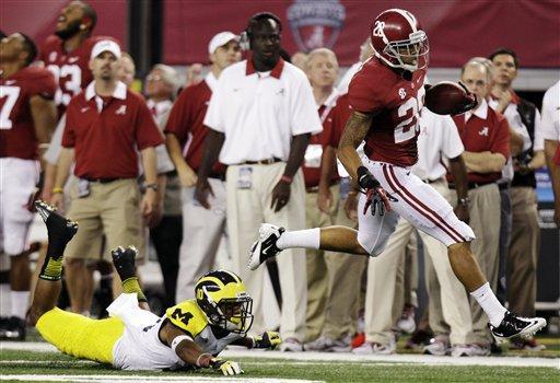 Alabama defensive back Dee Milliner (28) runs back a turnover past Michigan wide receiver Jeremy Gallon (10) during the first half of an NCAA college football game at Cowboys Stadium in Arlington, Texas, Saturday, Sept. 1, 2012. (AP Photo/LM Otero)
 