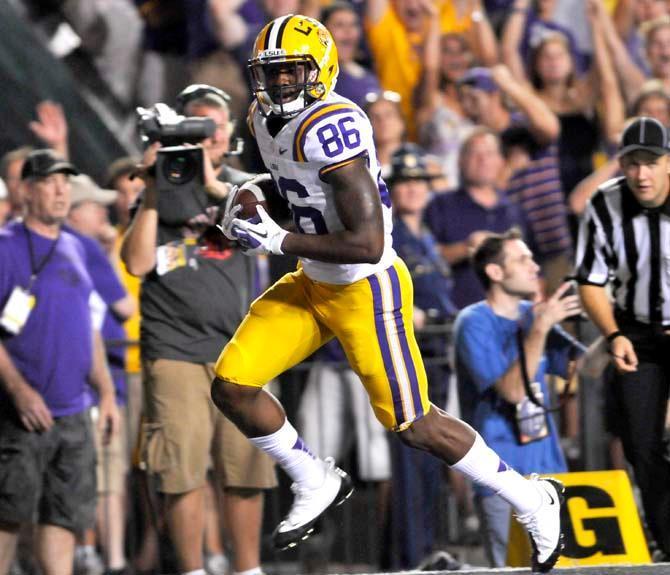 LSU junior wide receiver Kadron Boone (86) runs the football into the endzone for a touchdown Saturday Sept. 8, 2012 during the Tigers' 41-3 victory over the Washington Huskies in Tiger Stadium.