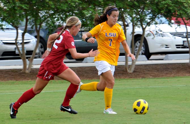 Freshman forward Fernanda Pi&#241;a (7) chases the ball away from an opponent Sunday, Sept 16, in a game against Alabama.
 