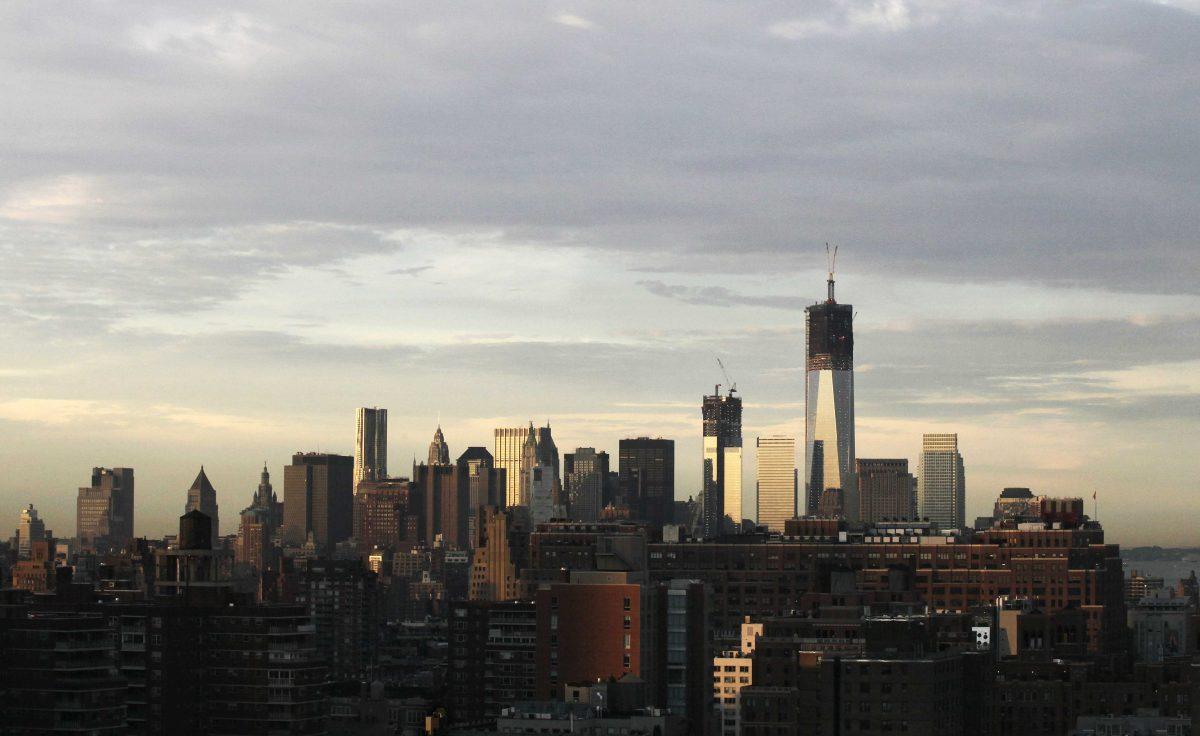 One World Trade Center, is now up to 104 floors, rises above the lower Manhattan skyline, Thursday, Sept. 6, 2012 in New York. Tuesday will mark the eleventh anniversary of the terrorist attacks of Sept. 11, 2001. (AP Photo/Mark Lennihan)