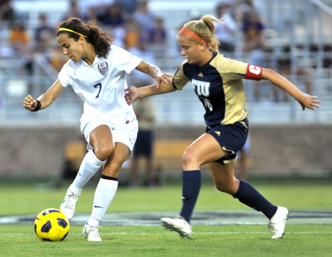 LSU freshman forward Fernanda Pi&#241;a (7) dribbles the ball around Florida International junior midfielder Nicole DiPerna during the Tigers' 0-0 draw against the Panthers Friday night at the LSU soccer complex.
 