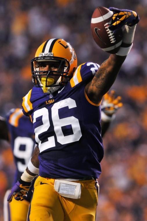 LSU sophomore safety Ronald Martin (26) celebrates after catching an interception during the Tigers' 63-14 victory against Idaho on Sept. 15, 2012, in Tiger Stadium.
 