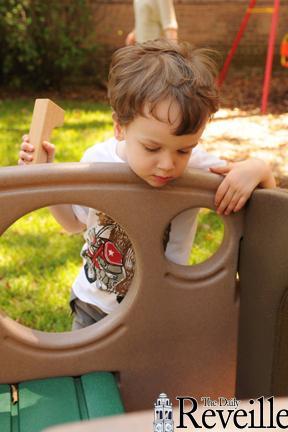 Mason, two years old, plays outside during his first day as an LSU Language Preschool student at the Dean French House on Infirmary Road.