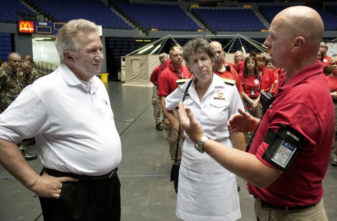 Mark Spradlin (Right) explains the situation to Assistant Secretary for Prepardness and Response for the U.S. Department of Health and Human Services Dr. Nicole Lavie (Middle) and Louisiana Department of Health and Hospitals State Health Officer Dr. Jim Guidrey on Friday during their visit to the PMAC. Friday, Aug. 31, 2012.
 