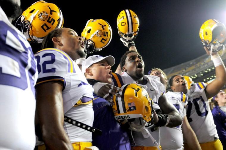 LSU head coach Les Miles sings the alma mater with his team on Saturday Sept. 8, 2012 after the Tigers' 41-3 victory over the Washington Huskies in Tiger Stadium.