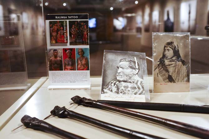 Maori Postcards featuring traditional Maori tattoos and a Kayan hand-tapping kit
 