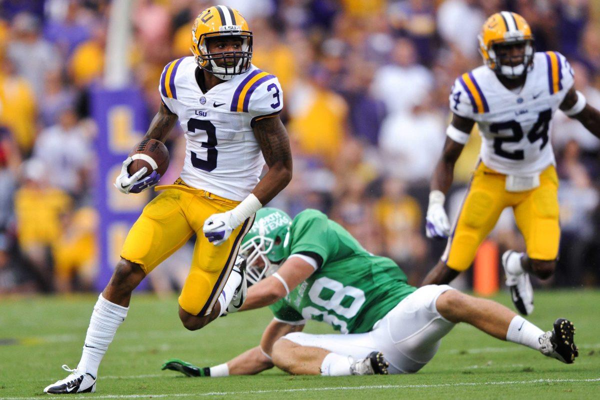 LSU sophomore wide receiver Odell Beckham Jr. dodges North Texas defenders as he returns a punt during the Tigers' 41-14 victory against the Mean Green on Sept. 1, 2012, in Tiger Stadium.