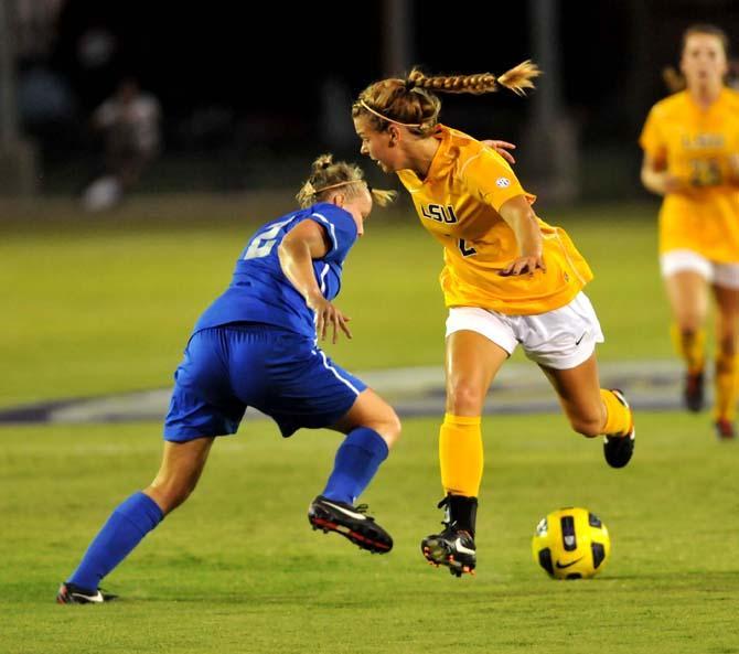 LSU junior forward Addie Eggleston and Memphis sophomore midfielder Kelley Gravlin battle for the ball Monday, Sept. 10, 2012 during the Tigers game against Memphis.
 