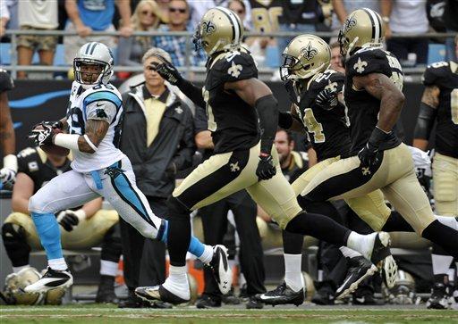 Carolina Panthers' Steve Smith (89) runs past New Orleans Saints players during the fourth quarter of an NFL football game in Charlotte, N.C., Sunday, Sept. 16, 2012. The Panthers won 35-27. (AP Photo/Rainier Ehrhardt)
 