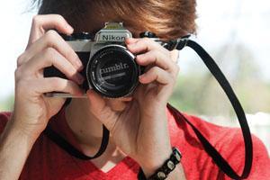 Tumblr sensation and art history freshman Andrew Harlow looks through his camera on LSU campus on Wednesday, March 14, 2012
 