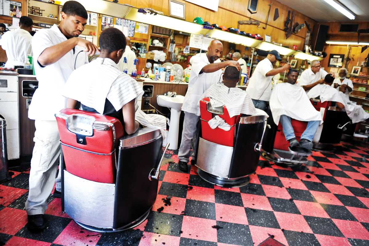 Patrons get their hair cut at Webb's Barber Shop on Eddie Robinson Sr. Drive off of Government Street. The Union Advisory Board is discussing hiring a barber for minority students because the current on-campus barber serves a clientele lacking in diversity.