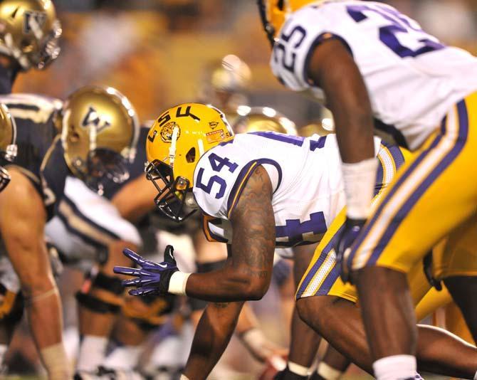 Sophomore defensive end Justin Maclin (54) lines up against the Washington Huskies offense Saturday, Sept. 8, 2012.
 