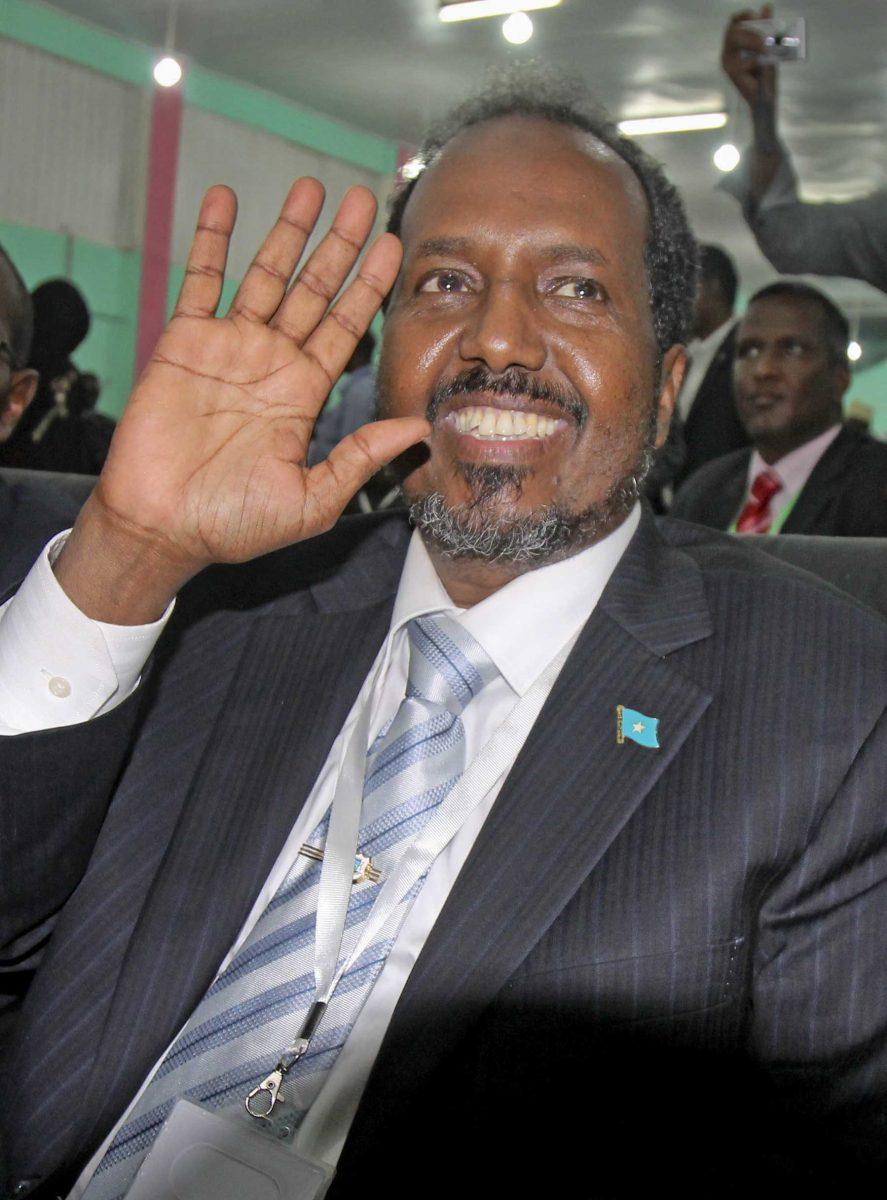 Somalia's new president Hassan Sheikh Mohamud, a political newcomer, waves at a ceremony after being elected by the Parliament over outgoing President Sheik Sharif Sheikh Ahmed who conceded defeat, in Mogadishu, Somalia Monday, Sept. 10, 2012. Somalia's Parliament elected a new president of the country's fledgling government Monday, a move that members of the international community say is a key step toward the east African nation's transition from a war-torn failed state to a nation with an effective government. (AP Photo/Farah Abdi Warsameh)