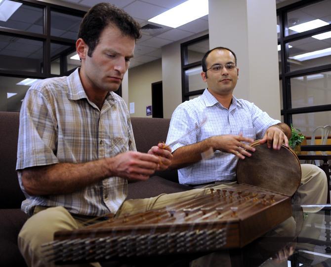 LSU engineering graduate student Navid Mozaffari (left) plays the santour while and physics graduate student Amirhosein Shadkam drums on a tombak on Tuesday in preparation of their upcoming peformance. Wednesday, Sept. 18, 2012.
 