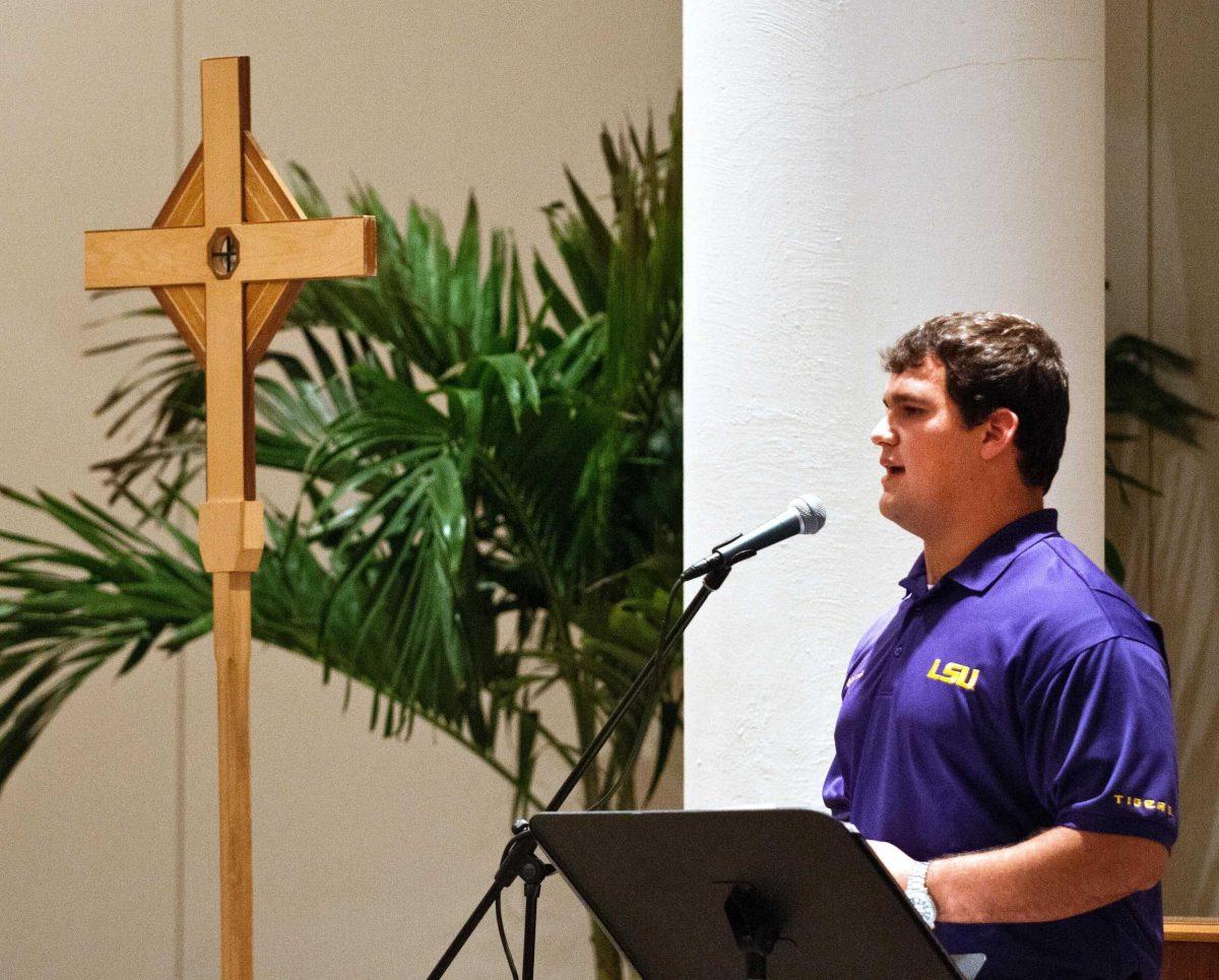 Junior center Ben Domingue speaks Sunday at Christ the King Catholic Church&#8217;s 8 p.m. mass.