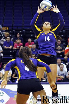 LSU sophomore setter Malorie Pardo sets the volleyball Saturday for her teammate junior Desiree Elliott (4) during the Purple and Gold Scrimmage in the Petet Maravich Assembly Center.
 