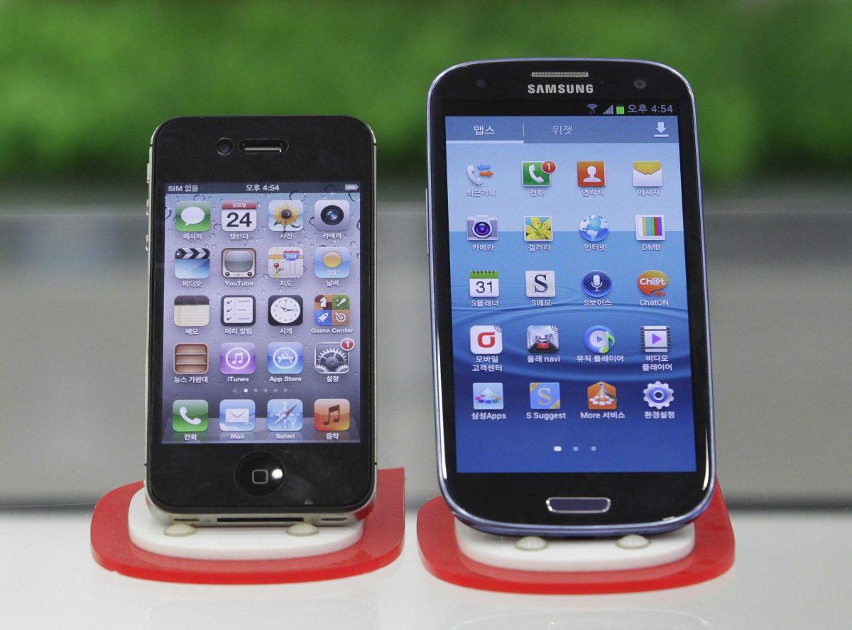 Samsung Electronics' Galaxy S III, right, and Apple's iPhone 4S are displayed at a mobile phone shop in Seoul, South Korea, Friday, Aug. 24, 2012. After a year of scorched-earth litigation, a jury decided Friday that Samsung ripped off the innovative technology used by Apple to create its revolutionary iPhone and iPad. The jury in San Jose, Calif., ordered Samsung to pay Apple $1.05 billion. An appeal is expected. (AP Photo/Ahn Young-joon)