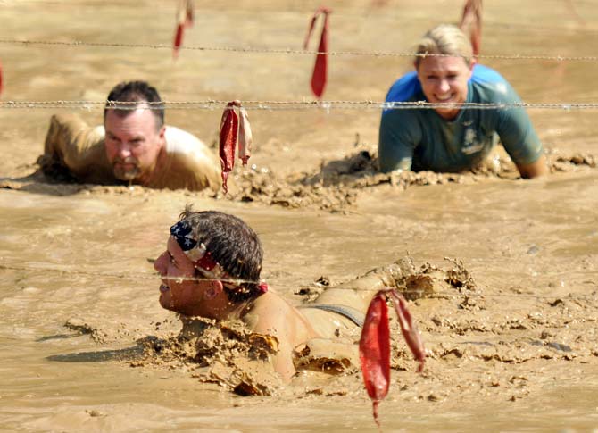 Runners face fire, mud and walls in 5k Warrior Dash