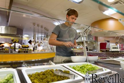 Environmental Engineering freshman Stephen Gowdy makes a salad for lunch at The 5 Dining Hall.