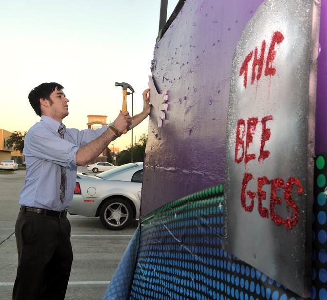 10/31 Consortium member Jacob Newsom hammers on Wednesday, Oct. 24, 2012 a bloody arm to the side of the 10/31 Consortium float that will roll in the Baton Rouge Halloween Parade on Saturday, Oct. 27, 2012.
 