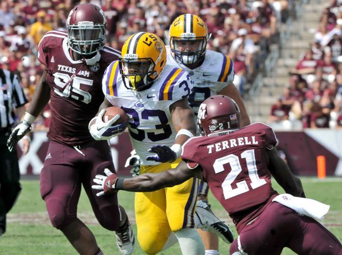 LSU freshman running back Jeremy Hill (33) rushes past Texas A&amp;M senior defensive back Steven Terrell on Saturday Oct. 20, 2012 at Kyle Field in College Station, Texas.
 