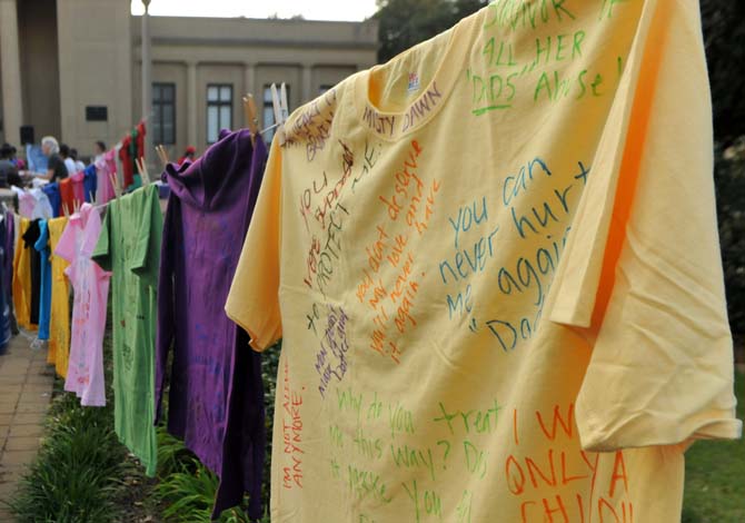 Baton Rouge Residents gathered on Sunday, Oct. 14, 2012, in front of the Memorial Tower for "Take Back the Night." Residents created t-shirts for the "Clothesline Project" as a way to help bear witness to violence against women.
 