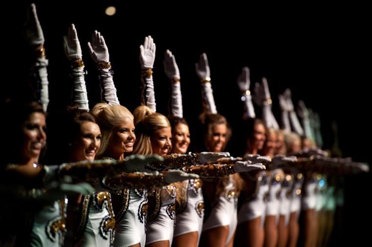 The LSU Golden Girls dance as Tiger Band plays the LSU fight song during Tigerama Friday, Oct. 7, 2011, in the PMAC.
 