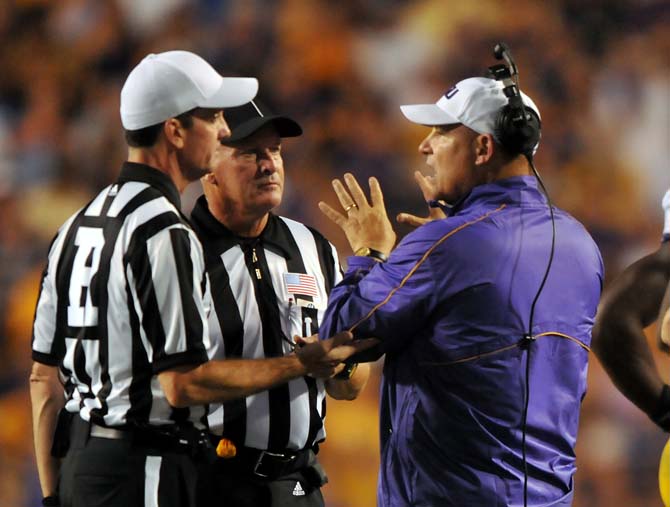 LSU football coach Les Miles speaks to referees Saturday, Sept. 8, 2012 during the Tigers' 41-3 win over the University of Washington Huskies in Tiger Stadium.