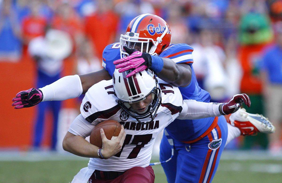 Florida's Donte Fowler, Jr. (6) sacks South Carolina quarterback Dylan Thompson (17) during the second half of their NCAA college football game against in Gainesville, Fla., Saturday, Oct. 20, 2012. (AP Photo/The Gainesville Sun, Brad McClenny) THE INDEPENDENT FLORIDA ALLIGATOR OUT