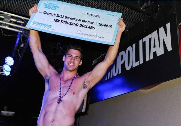 Ryan Chenevert celebrates with his $10,000 check from Cosmopolitan magazine after being named Bachelor of the Year.
 