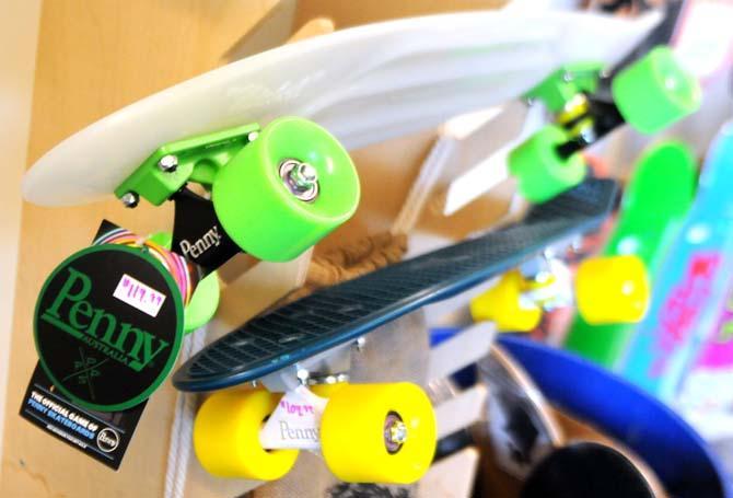 Two Penny skateboards are displayed on a rack Wednesday Oct. 31, 2012 in Fidna Skateshop.
 