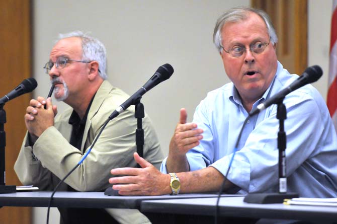 Professor emeritus Ed Overton (right) responds to a question about the role of environmental issues in the November election Thursday, Oct. 11, 2012 during the "Political Forum 2012 Presidential Election-The Environment" in the Dalton J. Woods auditorium in the School of the Coast and Environment.
 