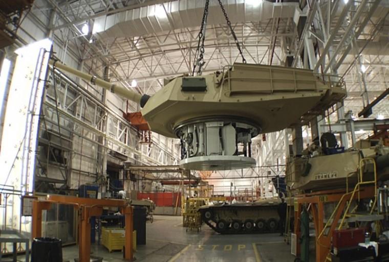 The General Dynamics Land System shows the production of an Abrams tank in Lima, Ohio. Rows of sand-colored armored vehicles ready for deployment are parked outside the nation&#8217;s only tank manufacturing plant.
 