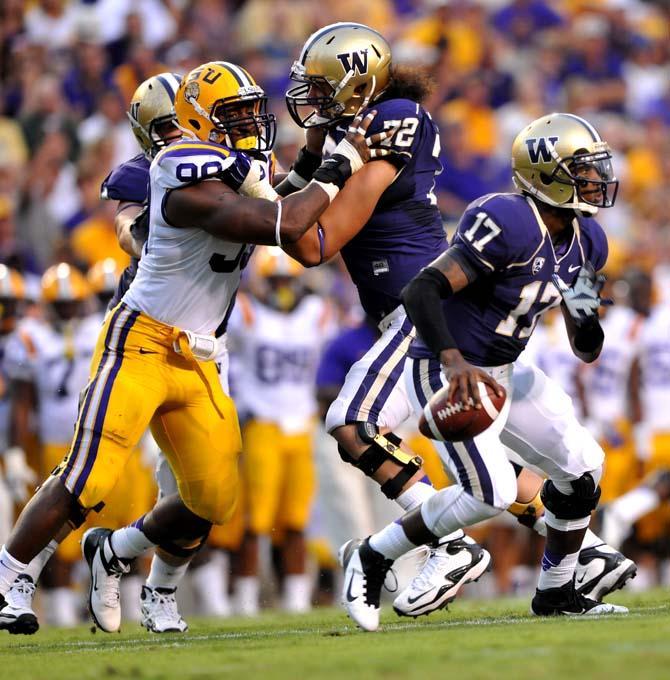 LSU junior defensive end Sam Montgomery (99) goes up against Washington sophomore offensive lineman Micah Hatchie Saturday, Sept. 8, 2012 during the Tigers' 41-3 win over the Huskies in Tiger Stadium.