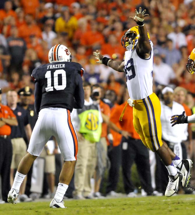 LSU junior defensive end Sam Montgomery (99) jumps to block a pass from Auburn sophomore quarterback Kiehl Frazier (10) during the Tigers' 12-10 victory over Auburn on Saturday Sept. 22,2012 in Jordan-Hare Stadium.