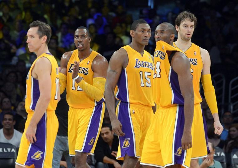 Members of the Los Angeles Lakers, from left, Steve Nash, Dwight Howard, Metta World Peace, Kobe Bryant and Pau Gasol, of Spain, look on during the second half of their preseason NBA basketball game against the Sacramento Kings, Sunday, Oct. 21, 2012, in Los Angeles. The Kings won 99-92. (AP Photo/Mark J. Terrill)
 