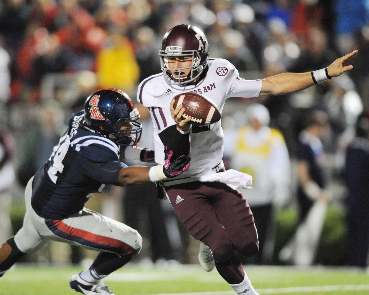 Texas A&amp;M quarterback Johnny Manziel (2) is sacked by Mississippi defensive lineman Issac Gross (94) during an NCAA college football game Saturday, Oct. 6, 2012, in Oxford, Miss. Texas A&amp;M won 30-27. (AP Photo/Oxford Eagle, Bruce Newman) MANDATORY CREDIT MAGS OUT NO SALES