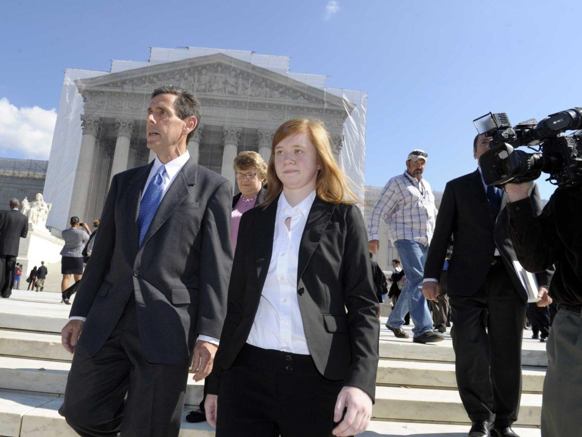 Abigail Fisher, the Texan involved in the University of Texas affirmative action case, and Edward Blum, who runs a group working to end affirmative action, walk outside the Supreme Court in Washington, Wednesday, Oct. 10, 2012. The Supreme Court is taking up a challenge to a University of Texas program that considers race in some college admissions. The case could produce new limits on affirmative action at universities, or roll it back entirely. (AP Photo/Susan Walsh)