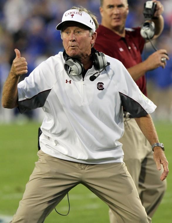 South Carolina coach Steve Spurrier gestures to an official during the first quarter of an NCAA college football game against Kentucky at Commonwealth Stadium in Lexington, Ky., Saturday, Sept. 29, 2012. (AP Photo/James Crisp)
 