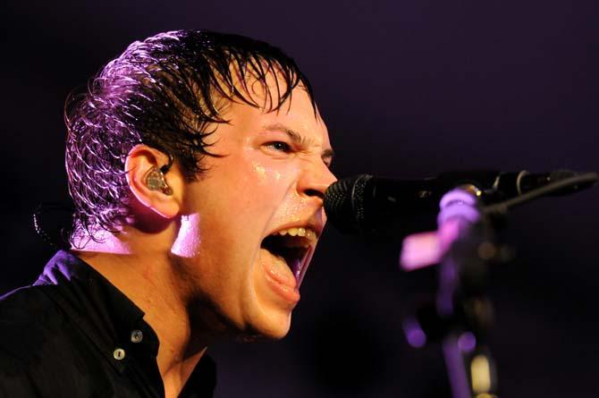 Say Anything guitarist and backup vocalist Jake Turner screams into the microphone during Voodoo Fest in New Orleans on October 26, 2012.
 