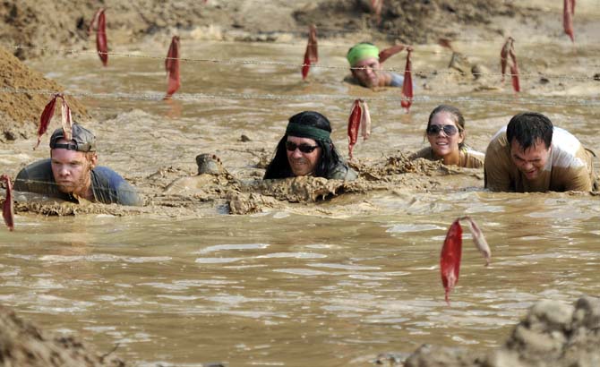 Runners face fire, mud and walls in 5k Warrior Dash